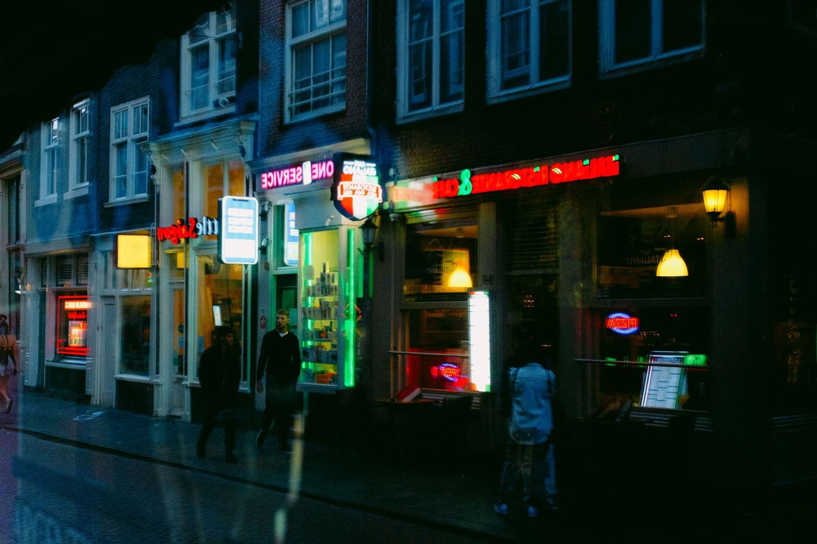 Exterior of a European sports betting shop with illuminated signage