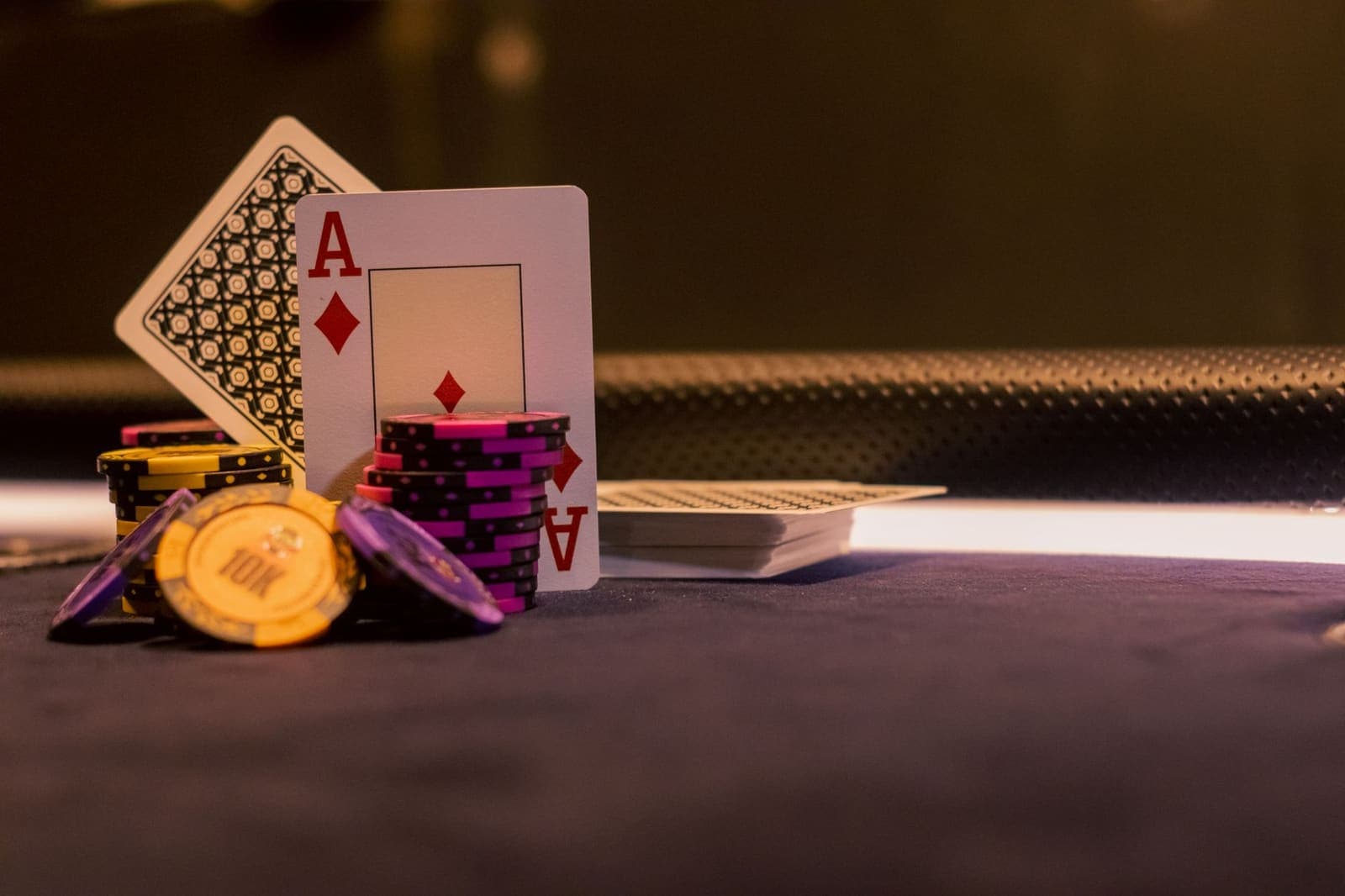 cards being dealt at a blackjack table
