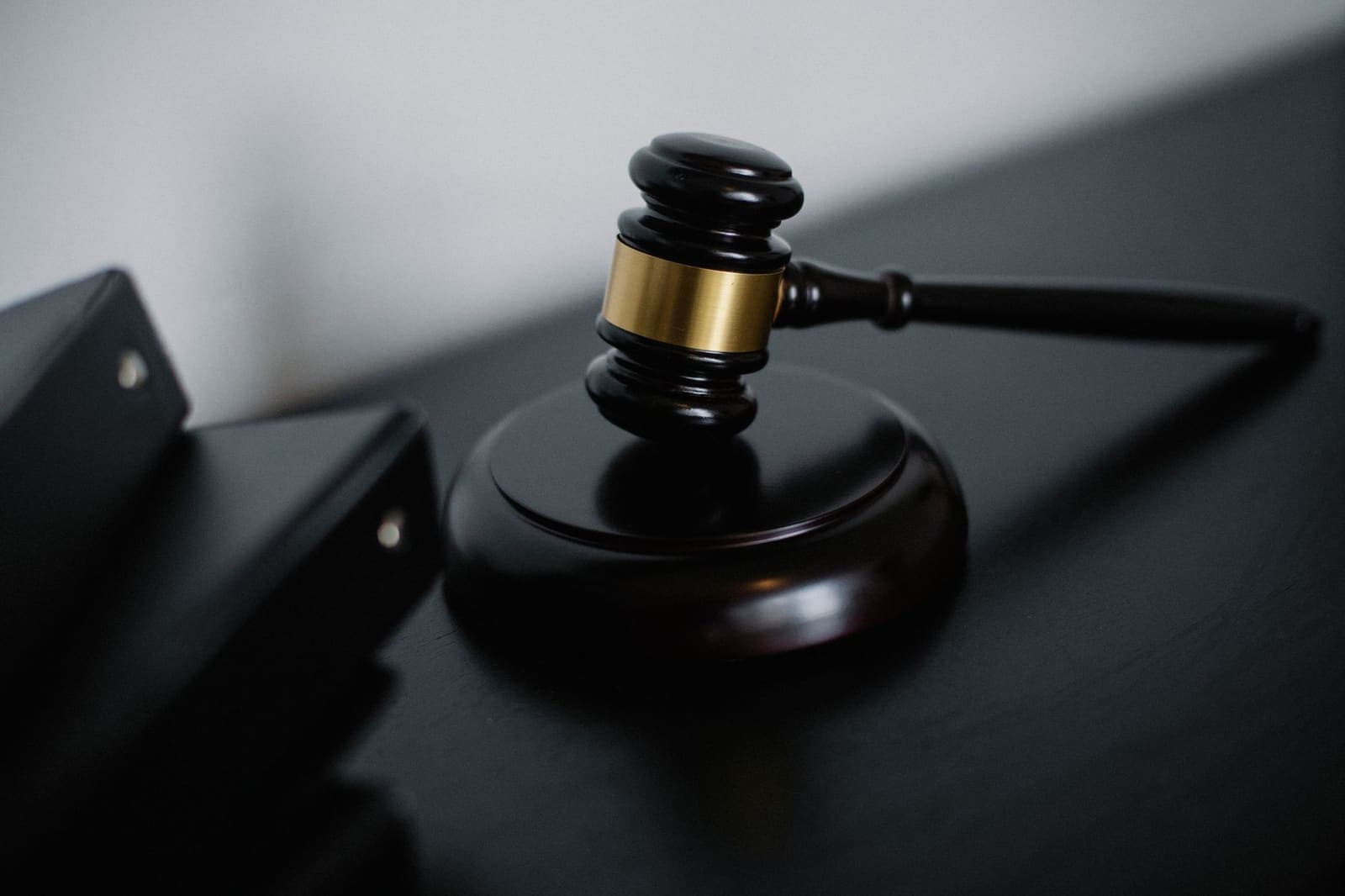 a judge's gavel on a wooden desk