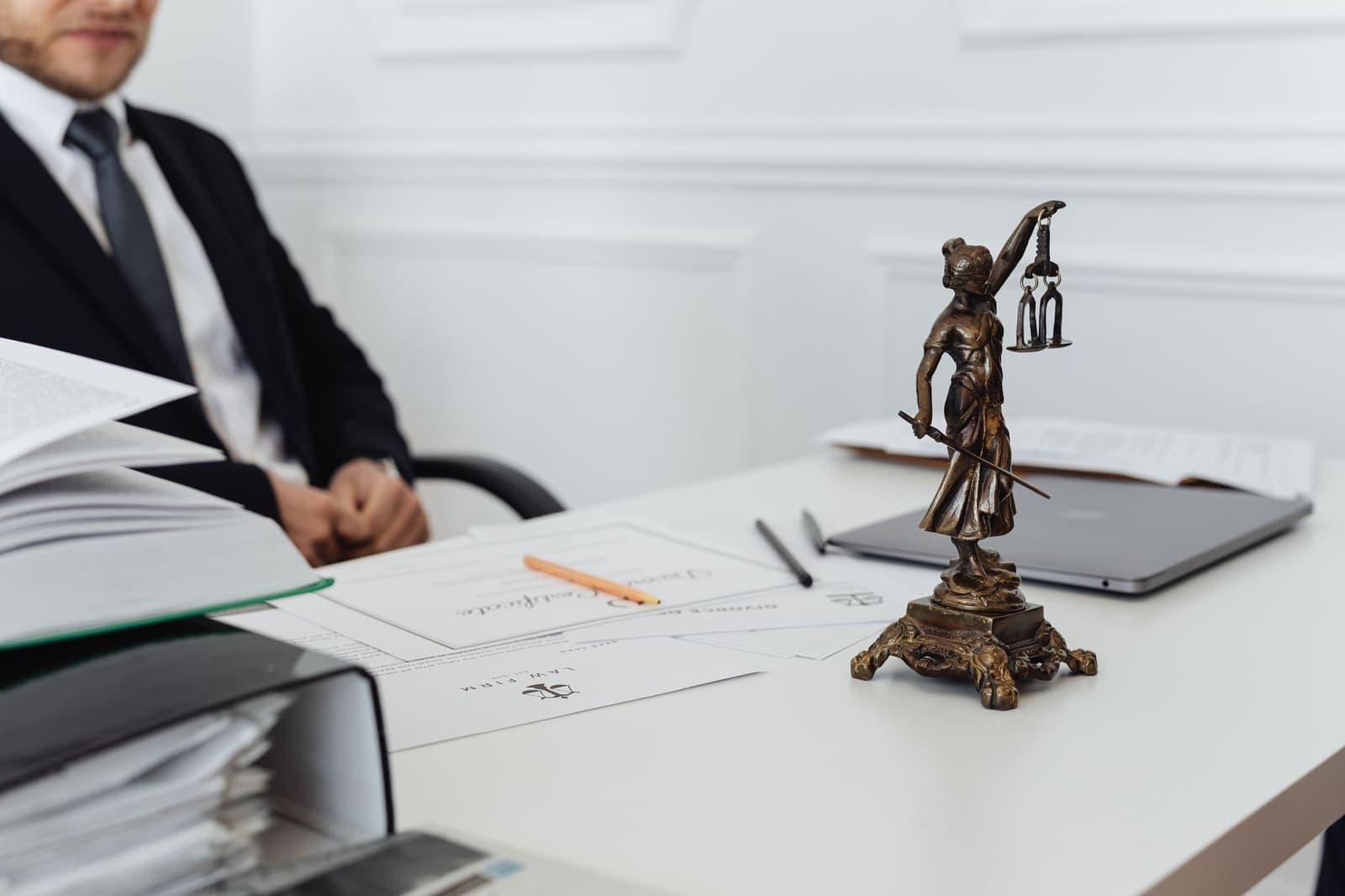 legal documents and a pen on a desk