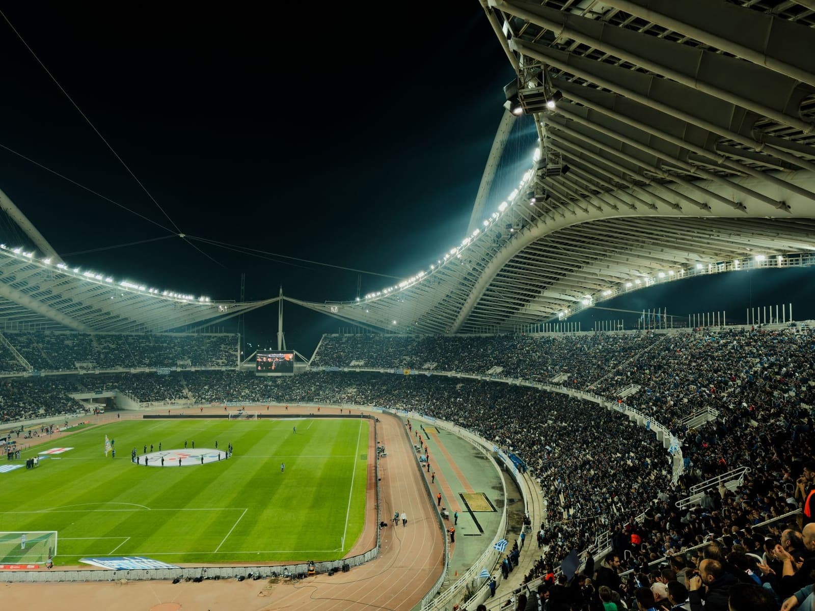 Floodlit football stadium during a night match, illustrating a Nations League fixture