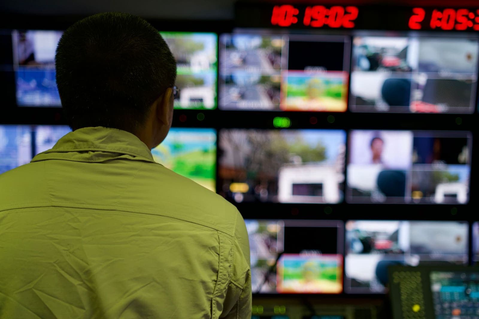 Newsroom with multiple screens displaying sports data and statistics