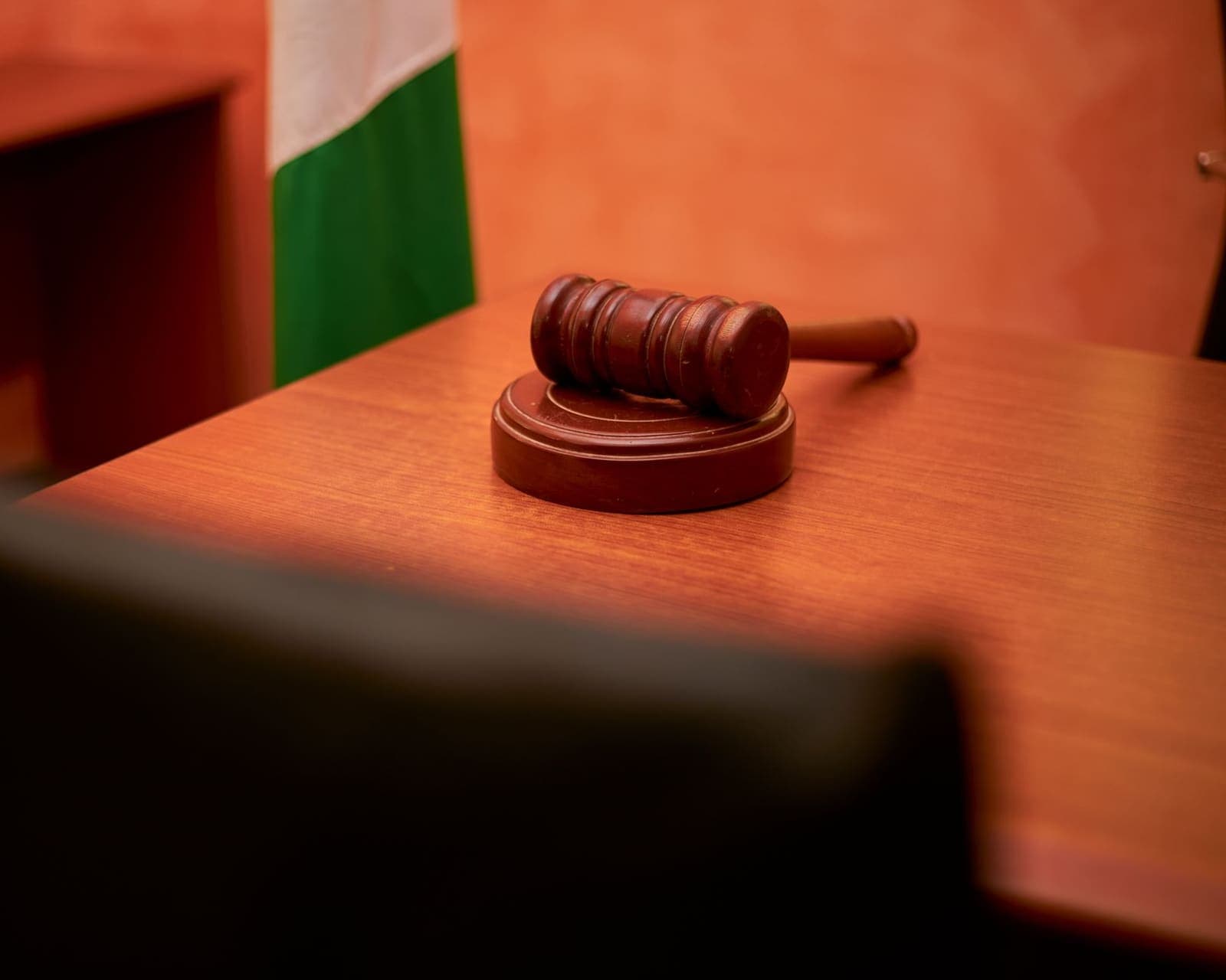 a judge's gavel on a wooden desk