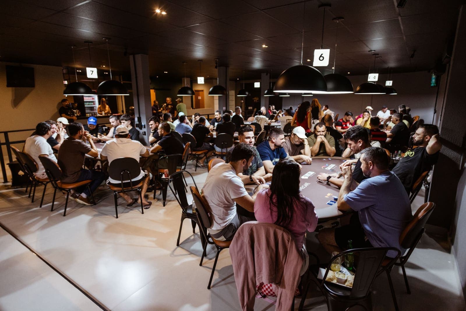 Rows of poker tables inside a casino gaming area