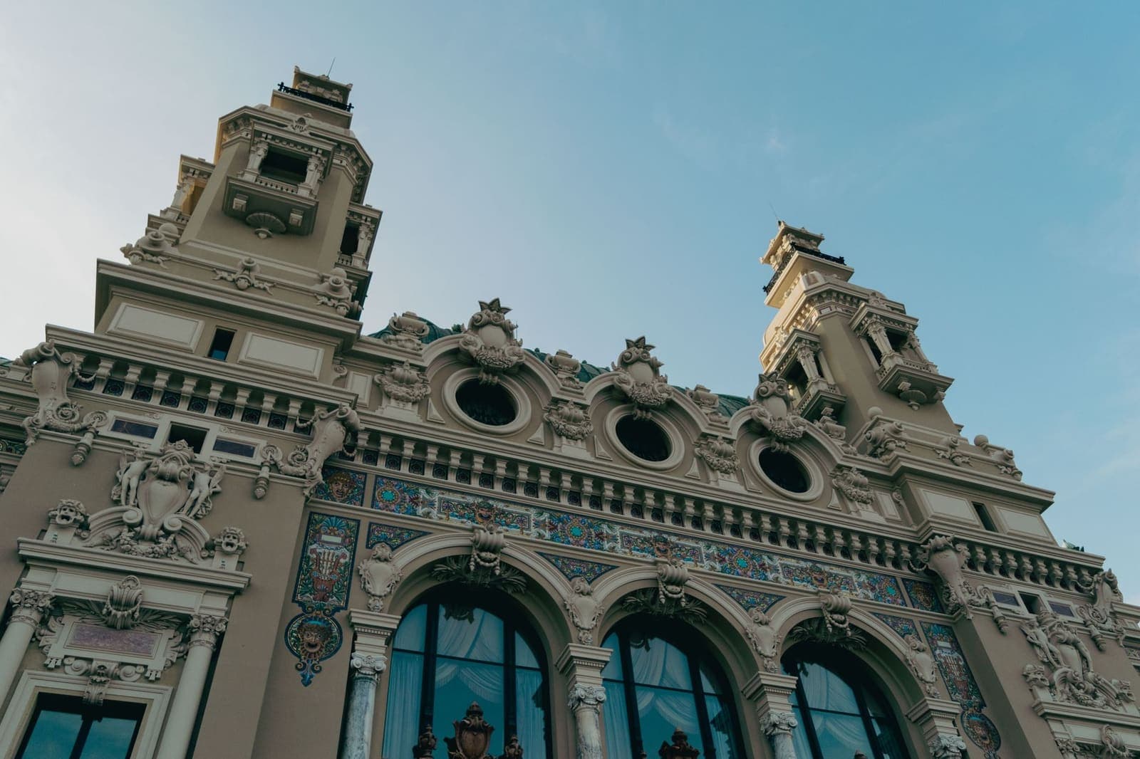 Historic European casino building with ornate facade lit up in the evening