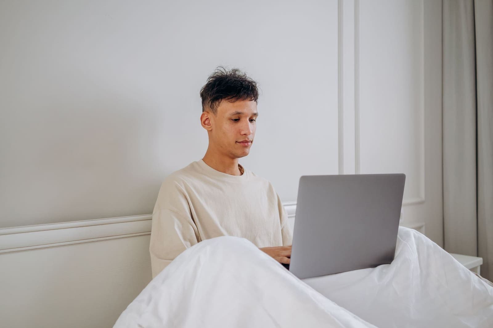 A person checking an online gambling account on a laptop at home