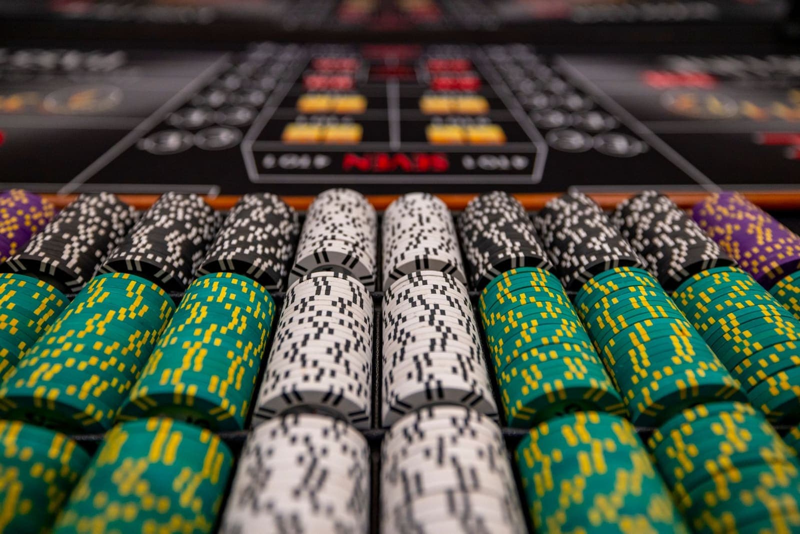 Rows of gaming tables on a casino floor in an Asian resort