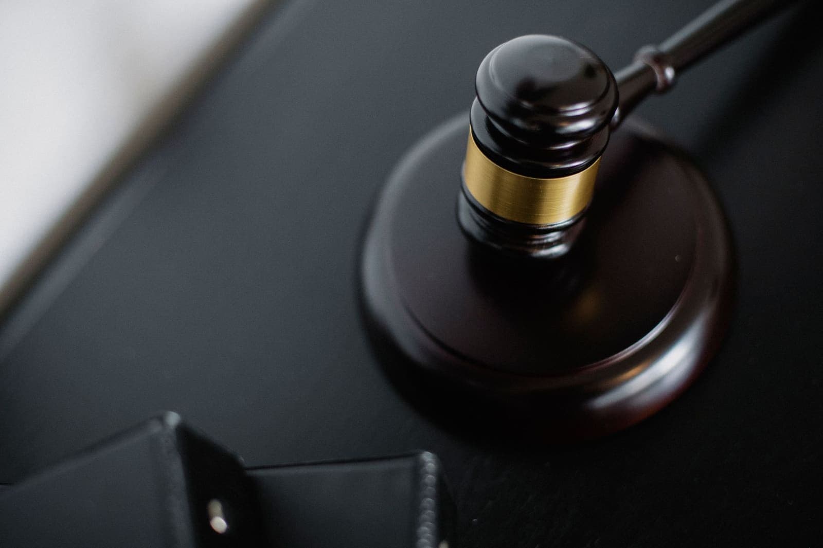 a judge's gavel on a wooden desk
