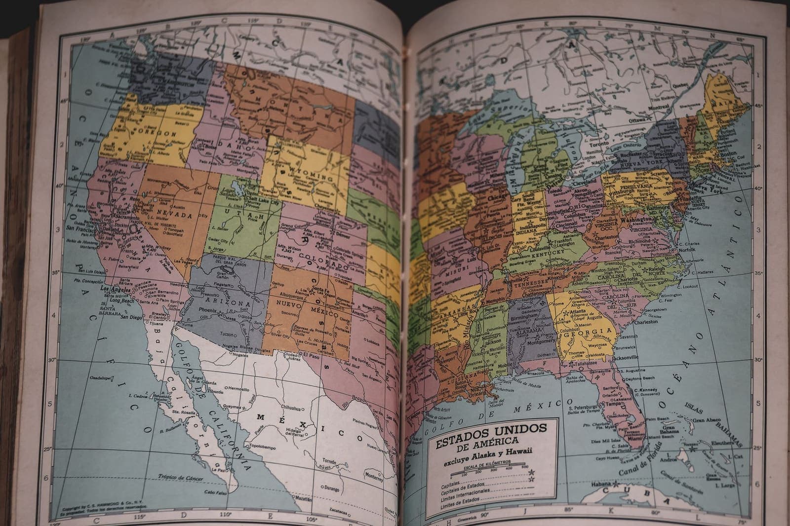 Map of the United States with several states highlighted on a dark background