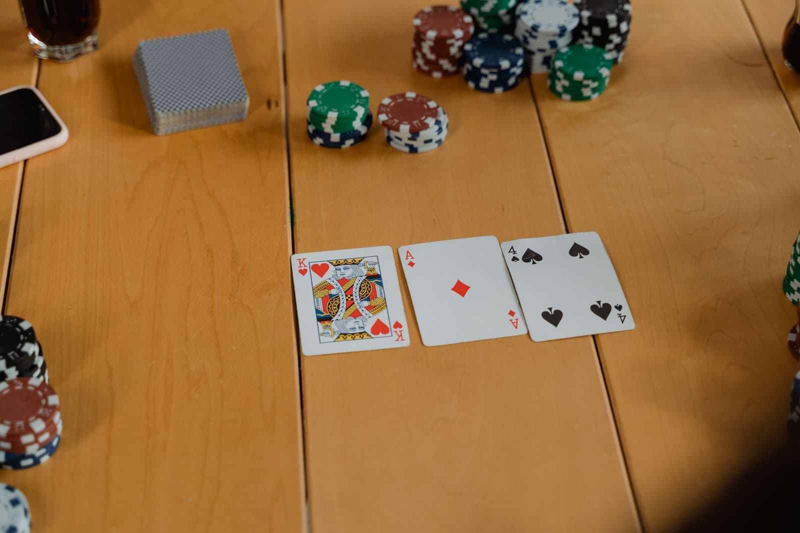 cards being dealt at a blackjack table